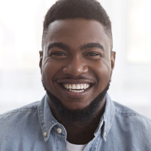 Closeup of man smiling with white teeth