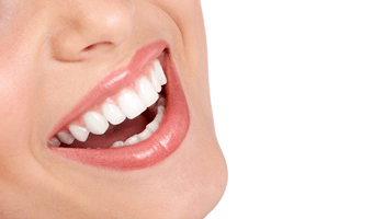 a person smiling after teeth whitening in Eatontown
